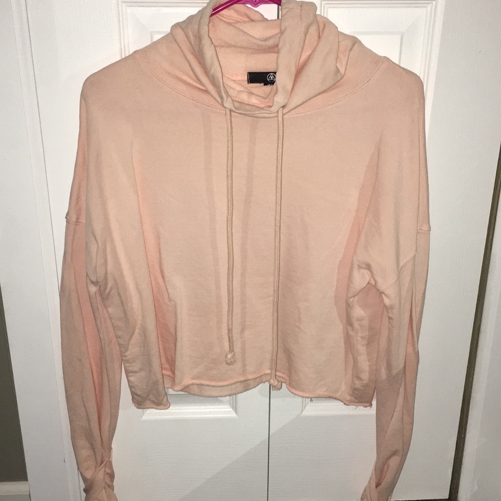 Rolled neck pink crop sweater